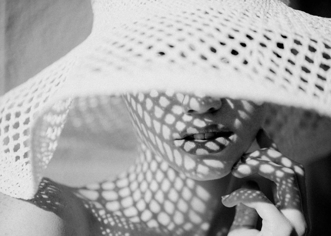  - Beautiful photo of a woman wearing a white sun hat.