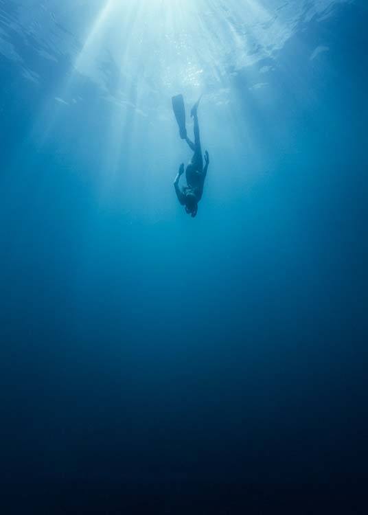  - Poster with an underwater shot of a diver in the indigo ocean.