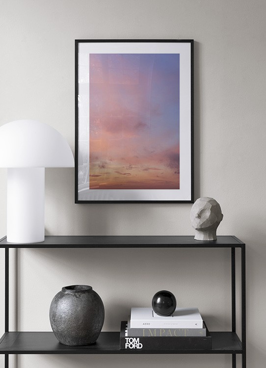  – Photograph of a sunset with pink clouds against a light purple sky