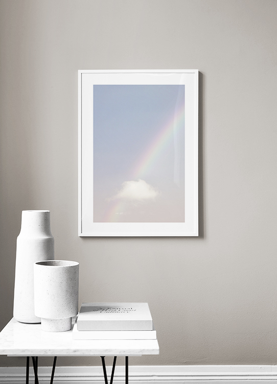  – Photograph of a cloud and rainbow on a pink and blue sky