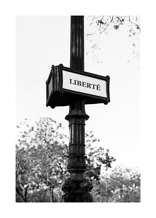 – Photography in black and white of a pole with a sign