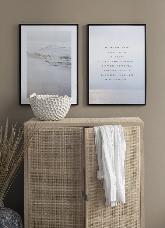  - Text print with quote about being like the ocean on a photograph of a calm ocean